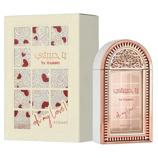 Ya Habibti rosegoud parfumfles met Asad Elixir bloemmotief en hartuitsparingen